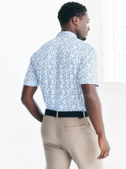 Next Blanc - Polo de golf à imprimé géométrique actif New