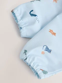 Next - Bavoir à manches de sevrage et d’alimentation Bleu dinosaure motif jungle Hot