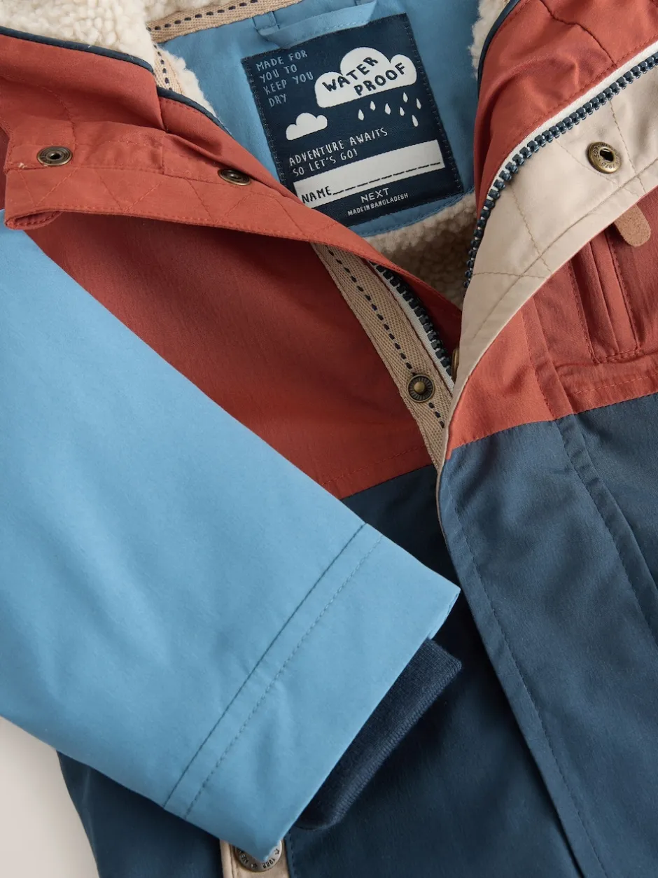 Next - Parka imperméable doublée de borg (3mois-7ans) Bleu marine/Rouge color block Clearance