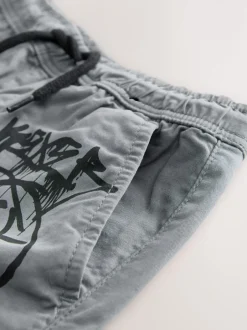 Next - Pantalon cargo (3-16ans) Bleu motif graffiti Online