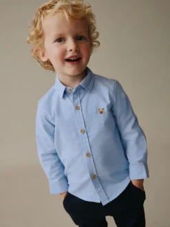 Next - Chemise Oxford à manches longues (3mths-7yrs) Bleu moyen motif personnage Outlet