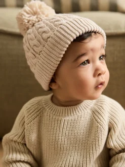 Next Crème - Bonnet à pompon en maille torsadée