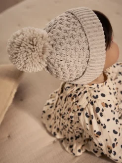 Next Crème - Chapeau Bébé Pom Gaufré tricoté Hot