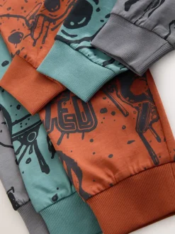 Next - Lot de 3 pyjamas à manches longues (3-16ans) Crâne graffiti vert/orange Online