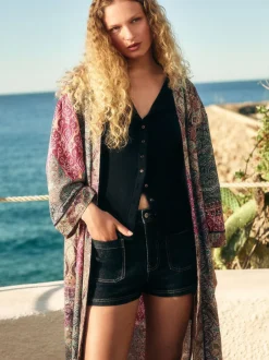 Next Délavage bleu - Mini-short en Denim à poches plaquées