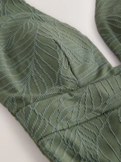 Next - Maillot de bain plongeant et galbant avec contrôle du ventre Feuille vert kaki texturée Outlet