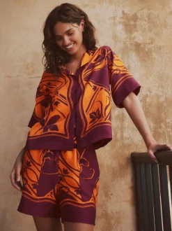 Next Imprimé bordures exotiques orange/bordeaux - Short de villégiature à taille élastique New