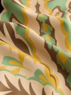 Next - Maillot de bain plongeant et galbant avec contrôle du ventre Motif paisley noir/vert Sale