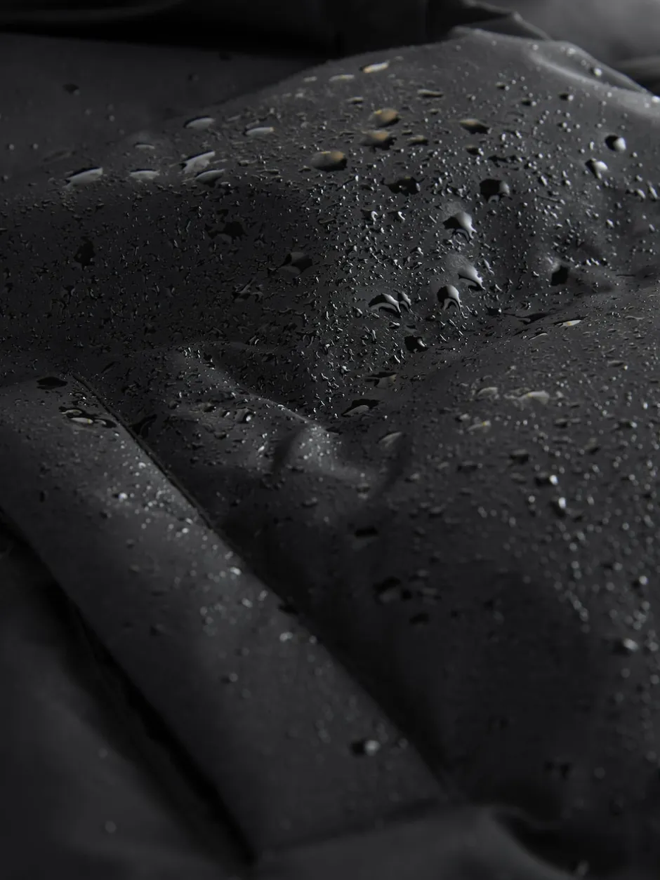 Next Noir - Doudoune imperméable doublée de fausse fourrure (3-16ans) Outlet