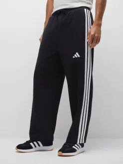 adidas Noir - Pantalons à jambe large en polaires à trois rayures Essentials