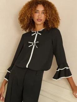 Love & Roses Noir et blanc avec nœud - Chemisier plissé à manches flûte à col rond New