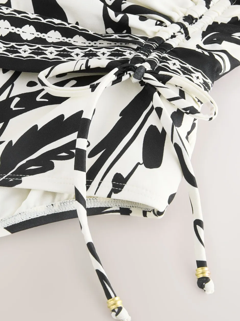 Next - Maillot de bain gainant le ventre froncé Noir/Crème Palmier Best