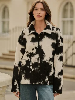 Next - Polaire douce en polaire en peau de mouton à col zippé Noir/écru imprimé vache Outlet