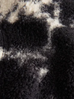 Next - Polaire douce en polaire en peau de mouton à col zippé Noir/écru imprimé vache Outlet