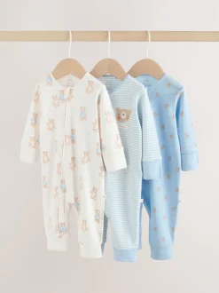 Next Ours bleu - Combinaisons de nuit à fermeture éclair pour bébés 3 Pack (0mths-3yrs) Online