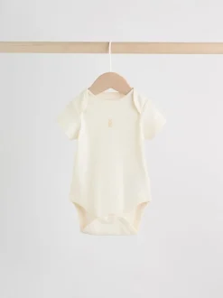 Next Personnage pastel multicolore - Lot de 7 bodies bébé à manches courtes New