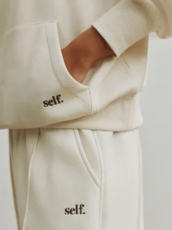 self. soi-même. Sweat-shirt à col zippé