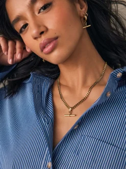 Next Tonalité d'or - Collier en acier inoxydable avec barre en T Outlet