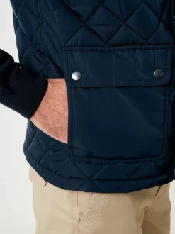 Saltwell Veste sans manches Heritage bleue matelassée à col cheminée en losanges